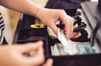 Notes and coins in an APG cash drawer